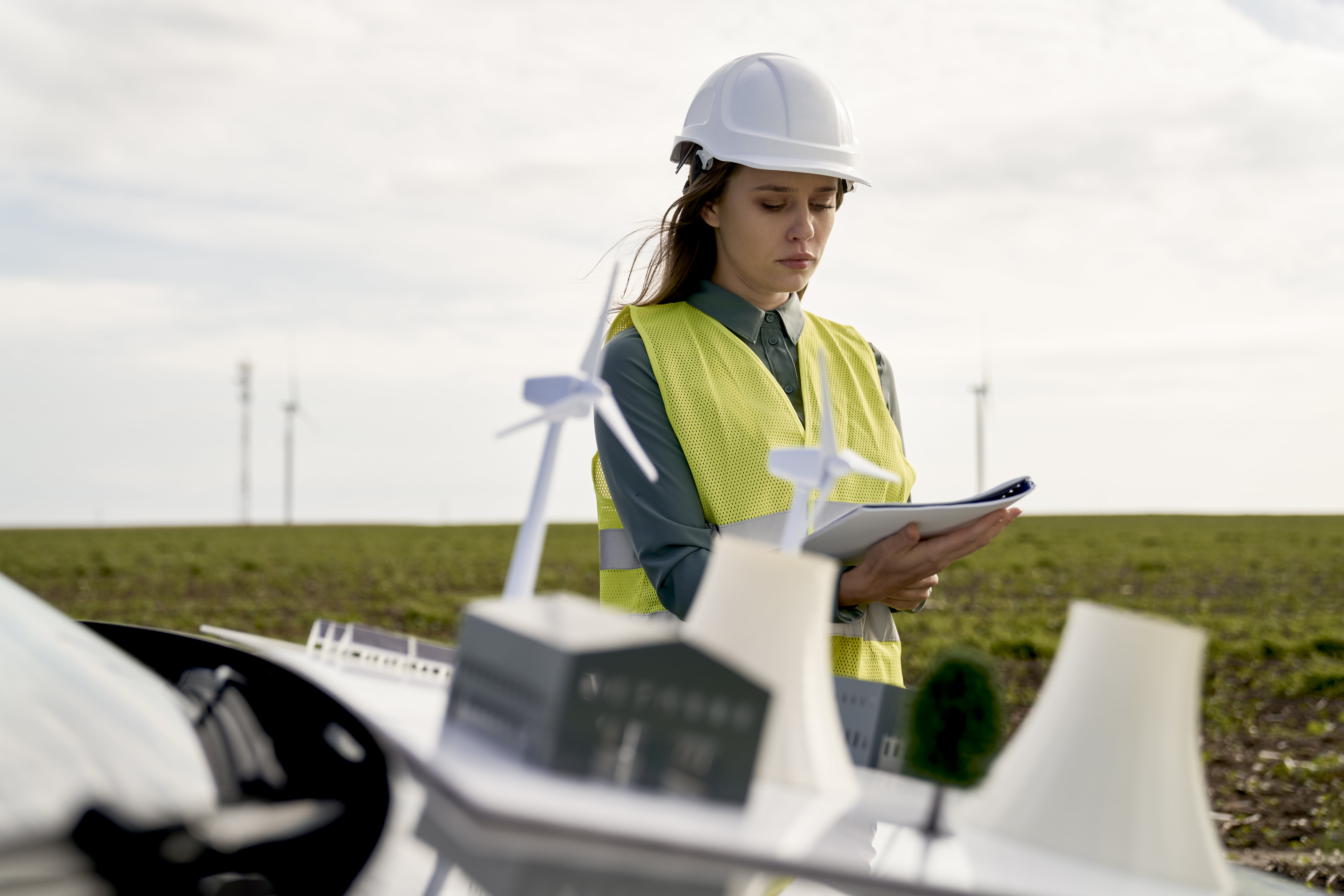 female-caucasian-engineer-standing-on-wind-turbine-2022-11-04-02-20-56-utc-min